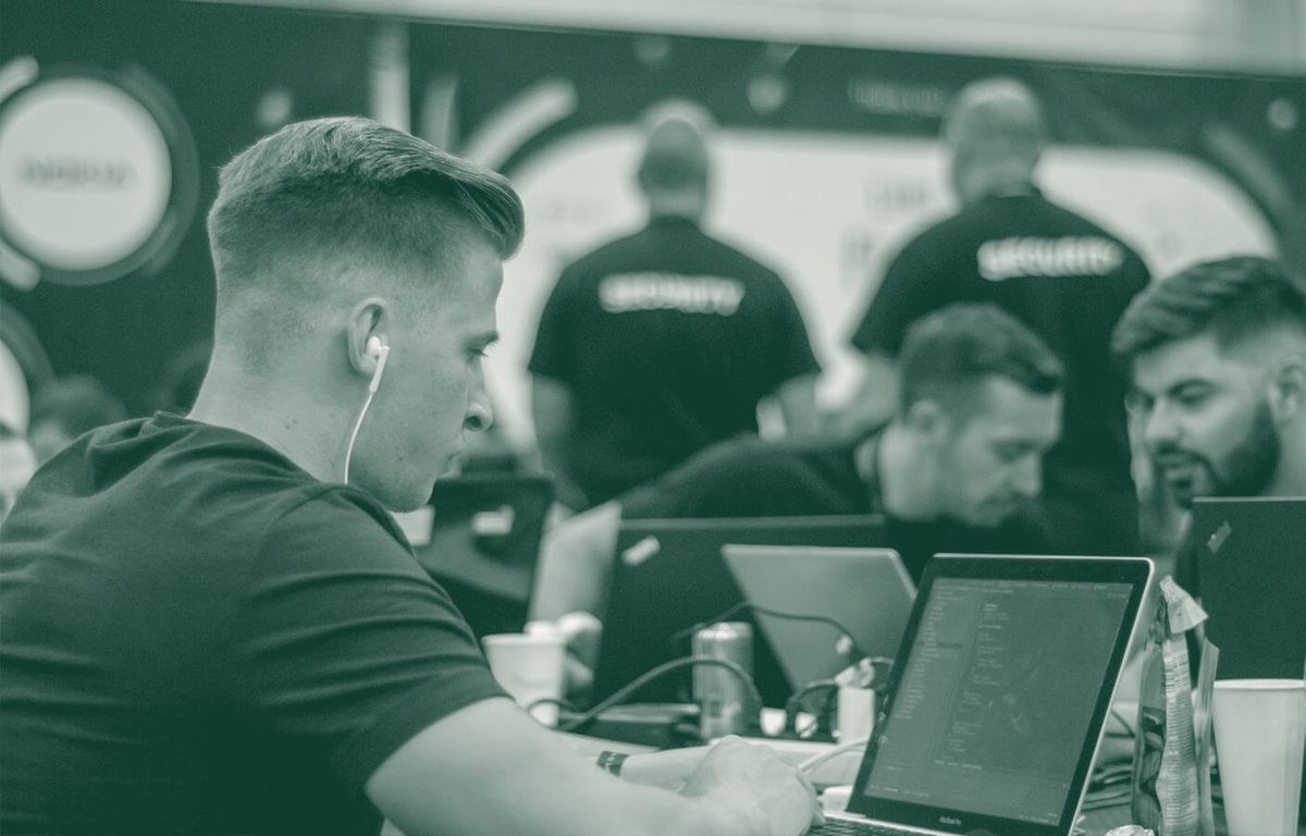A team member coding at a hackathon
