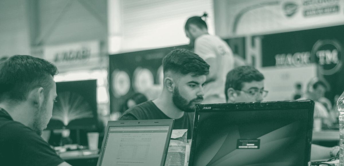 Team members concentrating at a hackathon