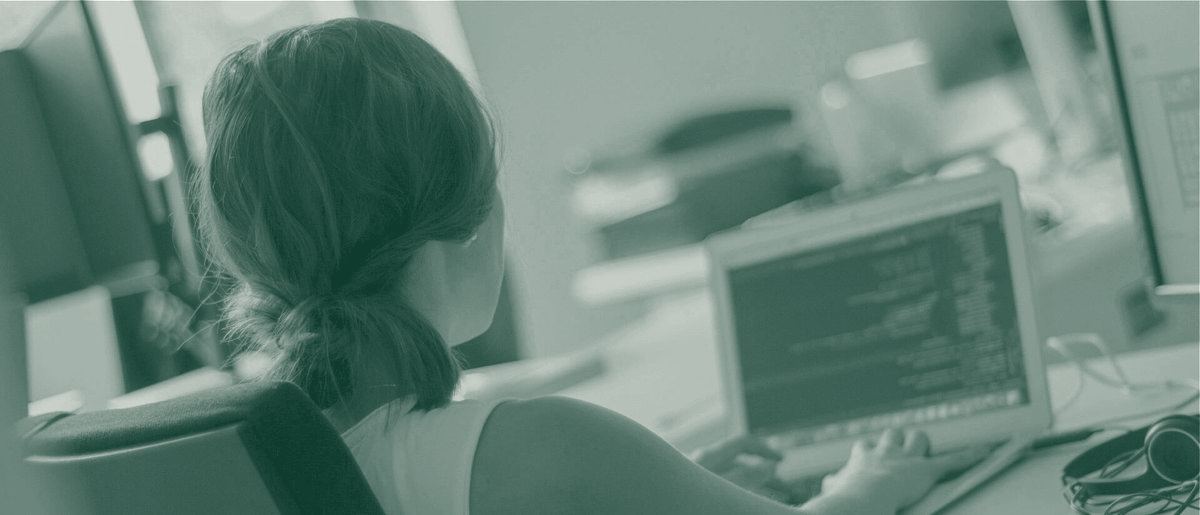 A developer working at her laptop in the studio
